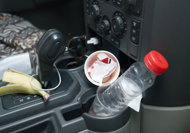 Car interior with water bottle in the cup holder